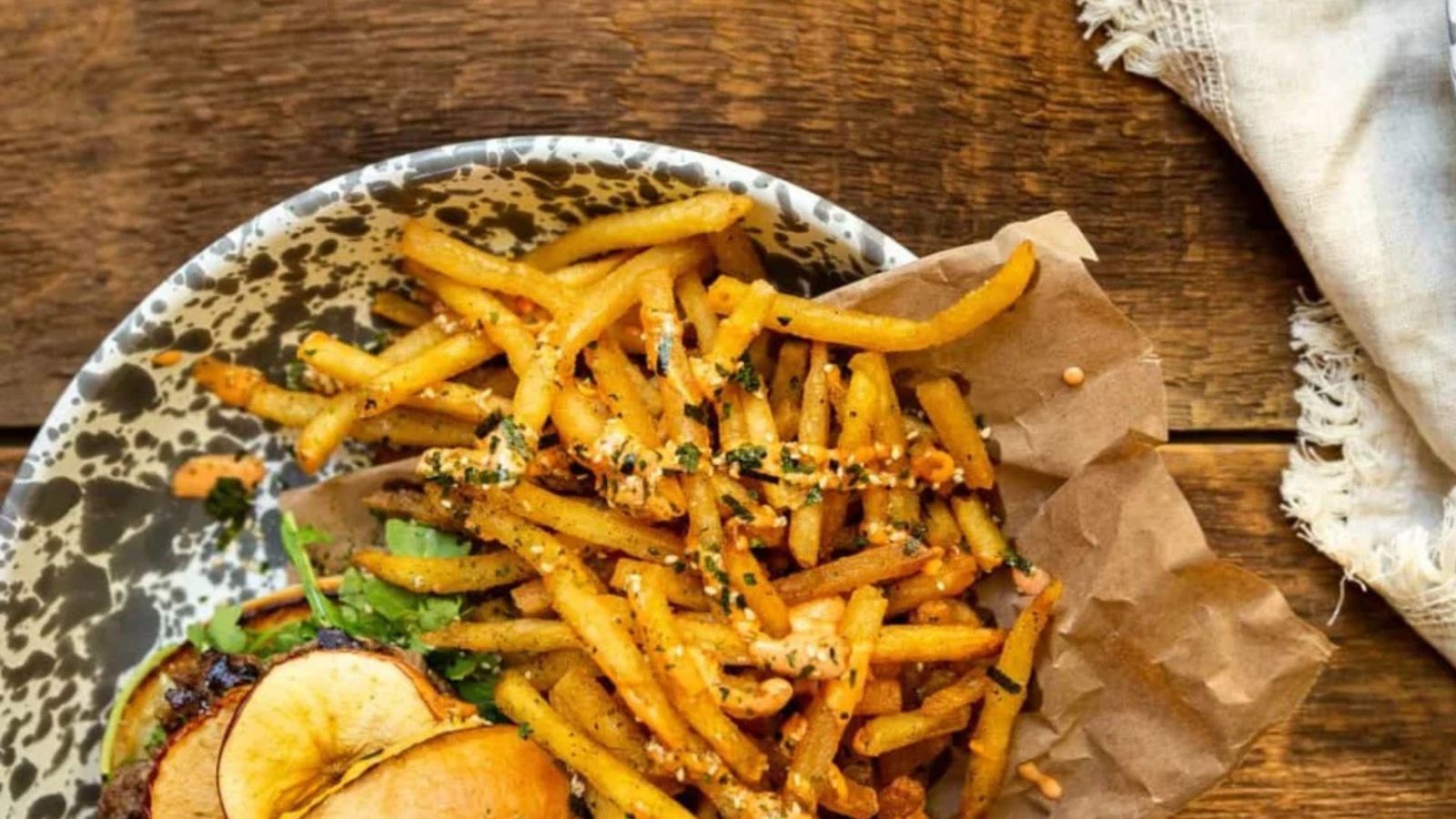Fries cooked in beef tallow crisped golden and sprinkled with furikake seasoning for crunch.