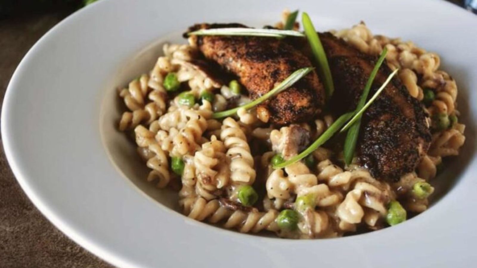 Chicken mac and cheese cooked blackened style.