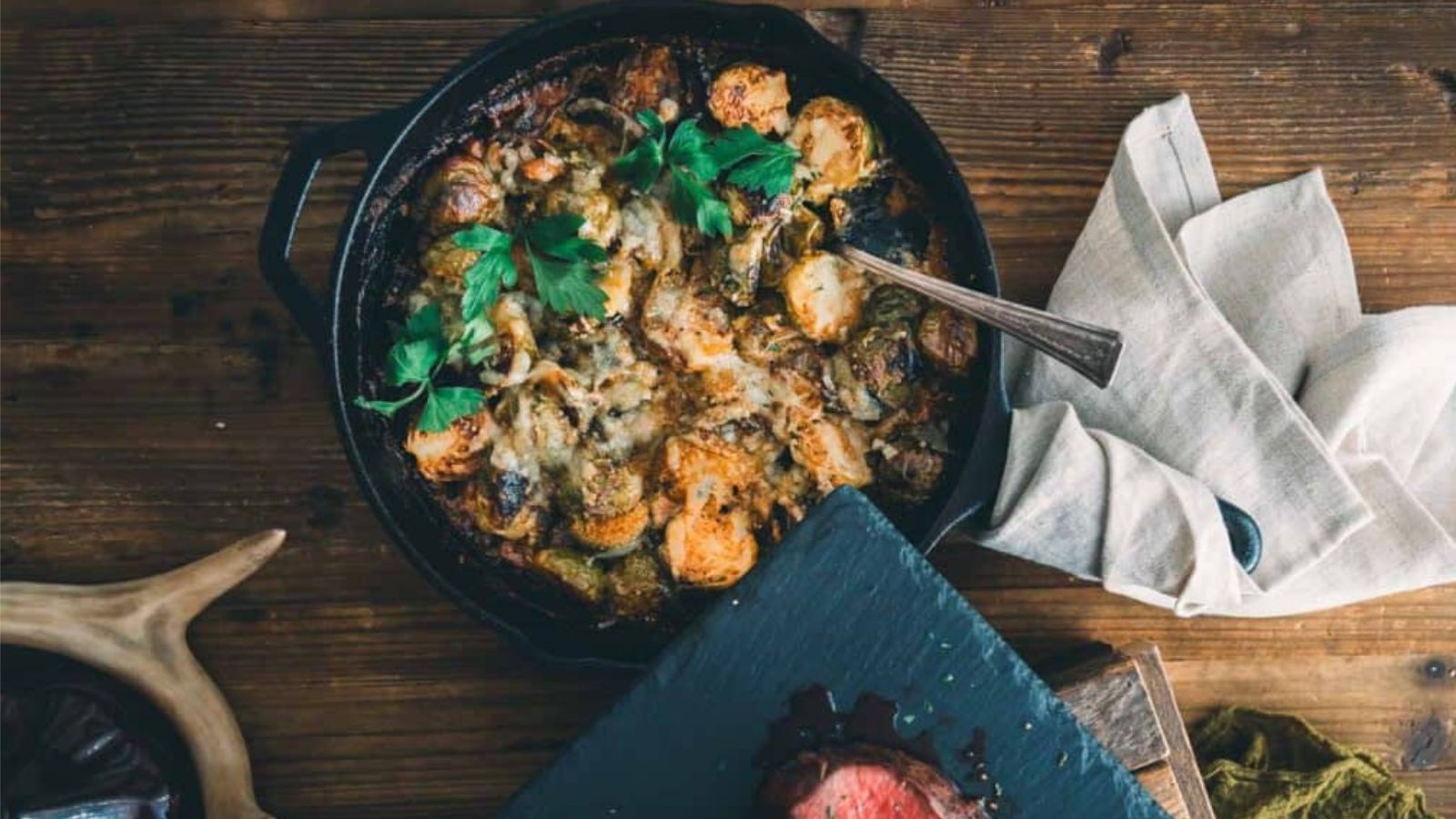 Brussels sprouts au gratin baked with cheese bubbling and golden on top.