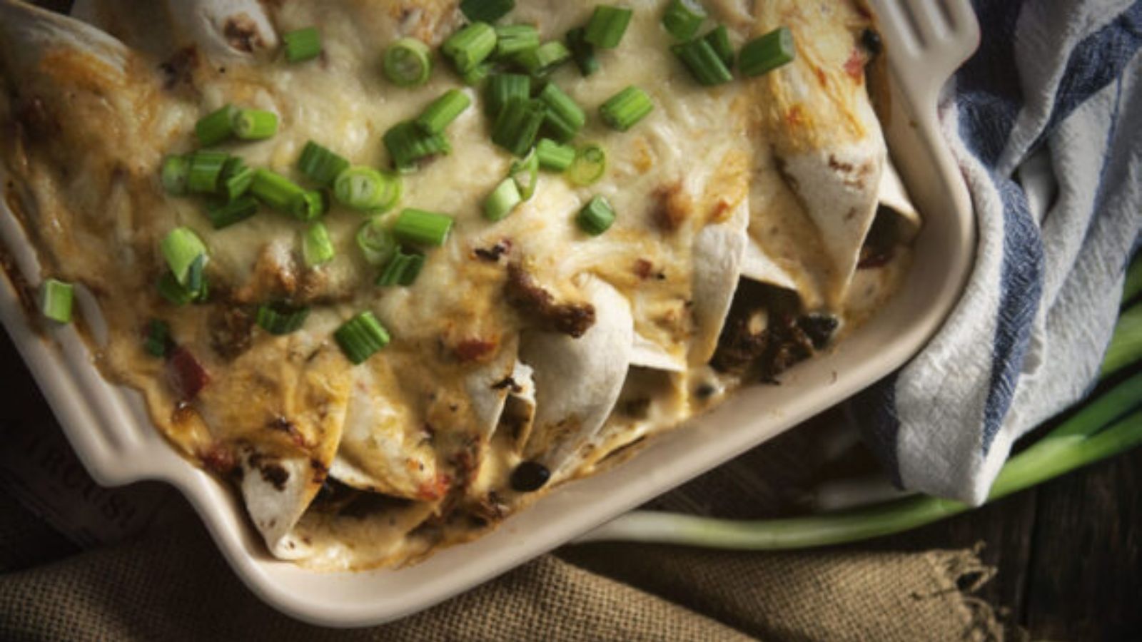 Seafood enchiladas baked in creamy Cajun sauce.
