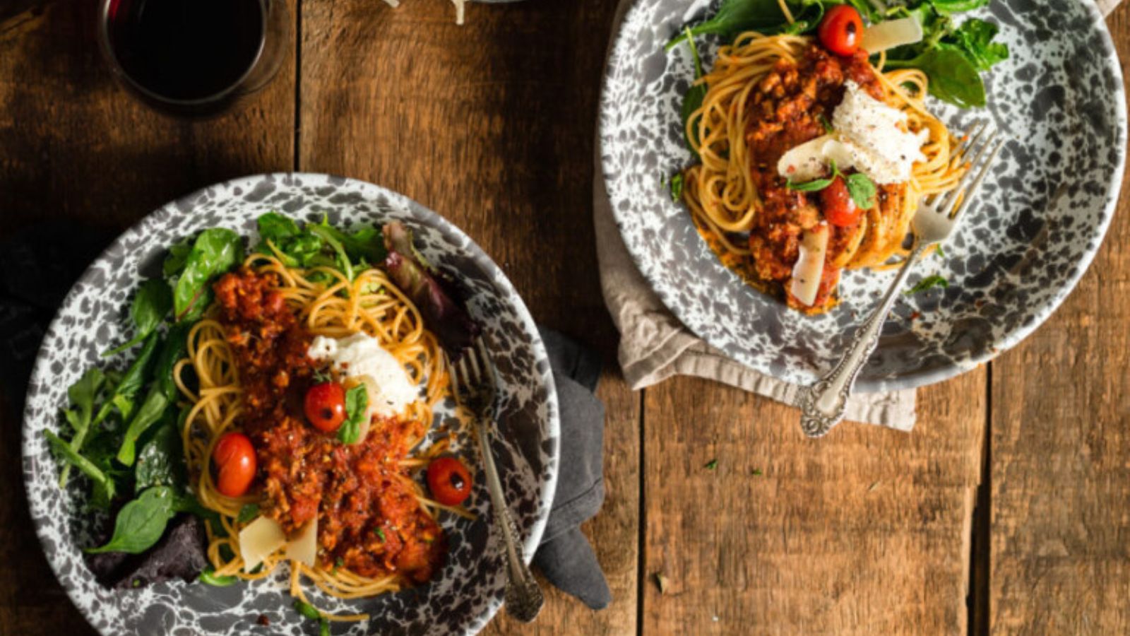 Meat sauce simmered thick with tomatoes and ground beef visible in the pot.