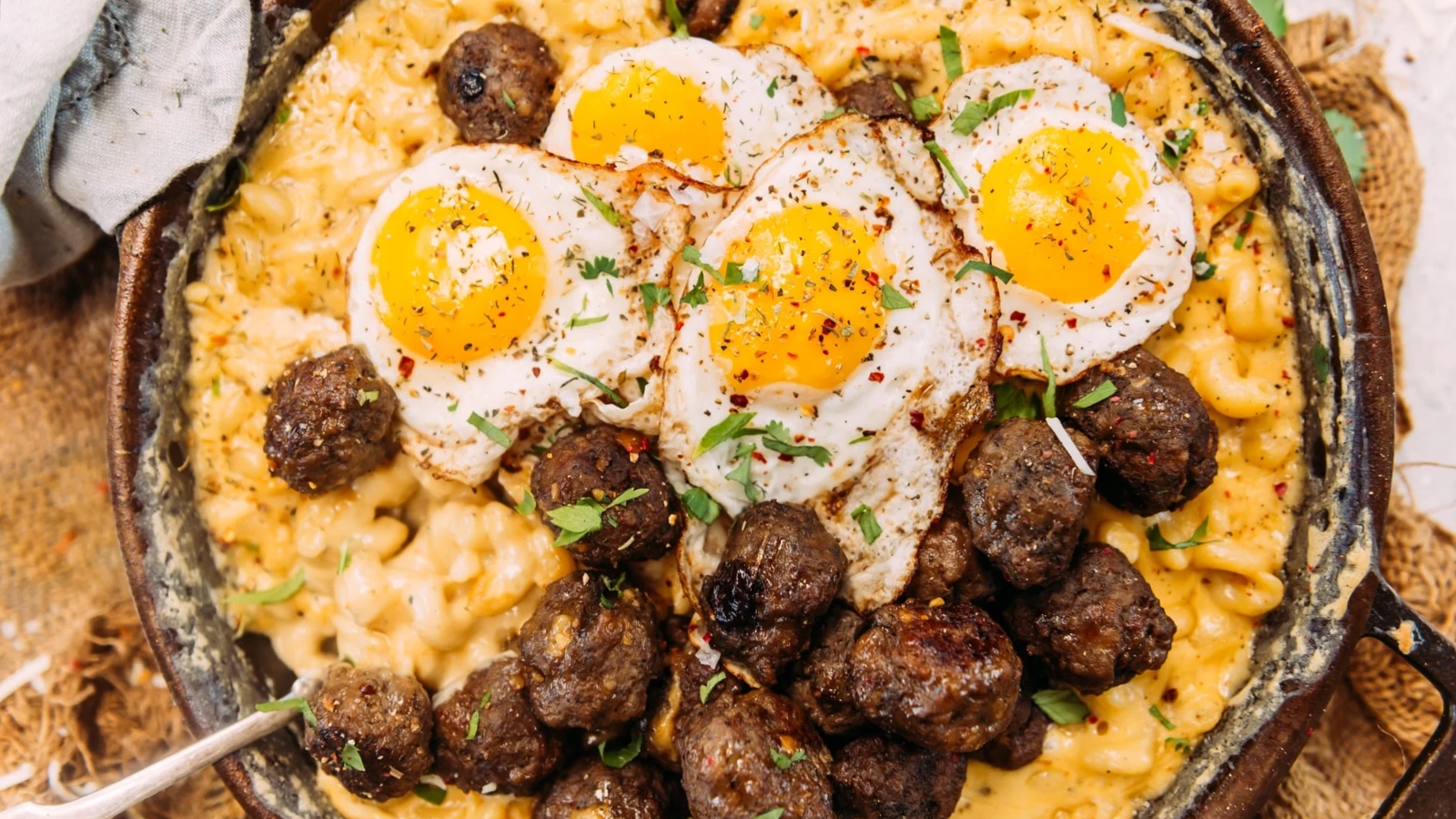 Breakfast mac and cheese loaded with maple meatballs.