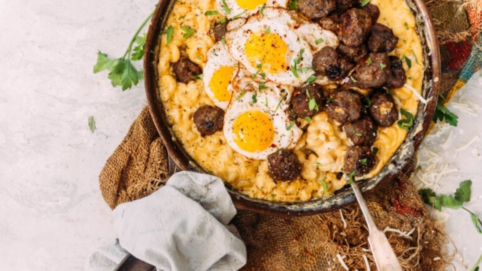Breakfast mac and cheese loaded with maple meatballs.