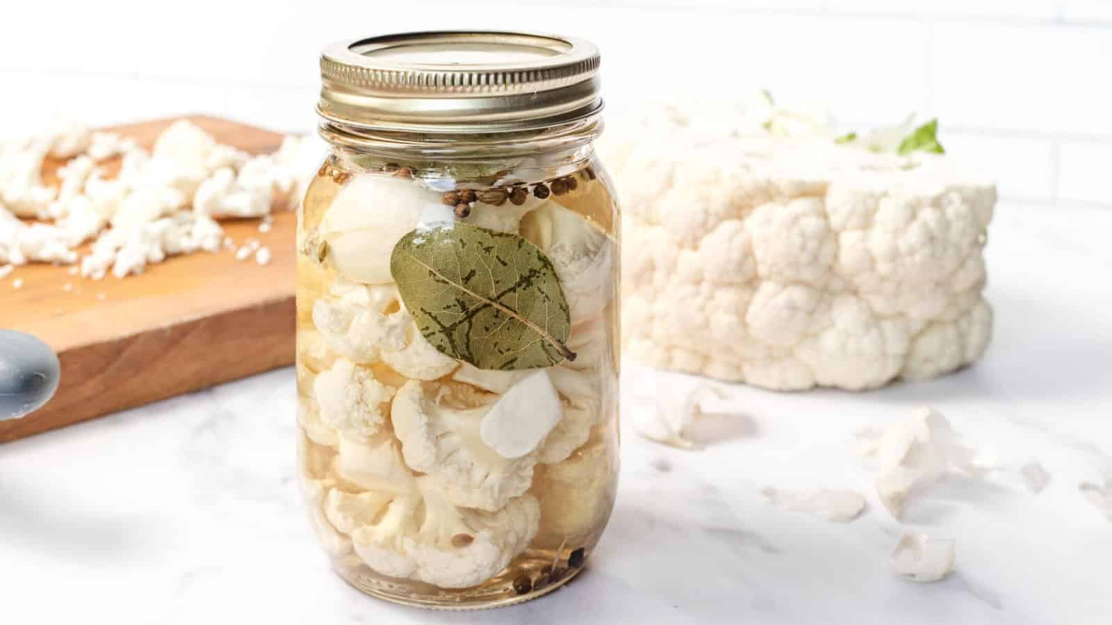 Jar of pickled cauliflower with spices.
