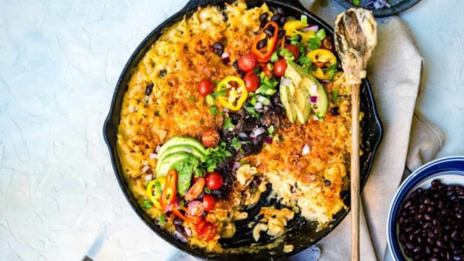 Mac and cheese blended with smoked pulled pork and browned edges.