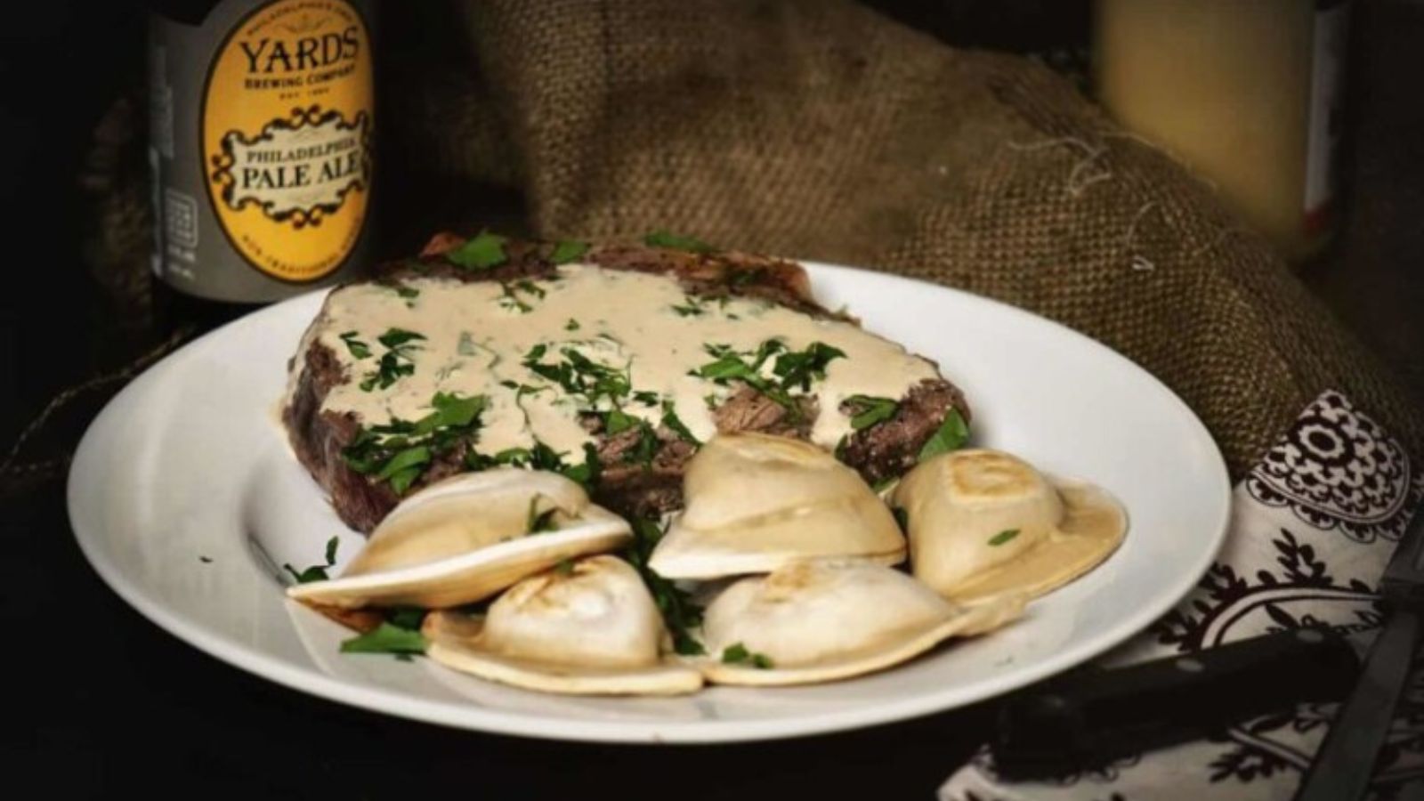 Steak au poivre seared with peppercorn crust.