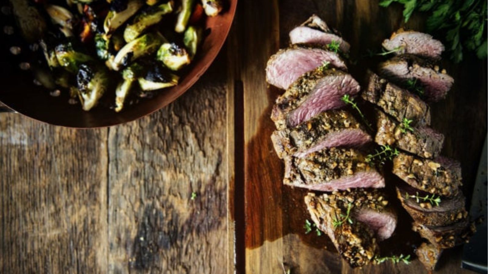 Beef tenderloin grilled with walnut crust and charred Brussels sprouts.