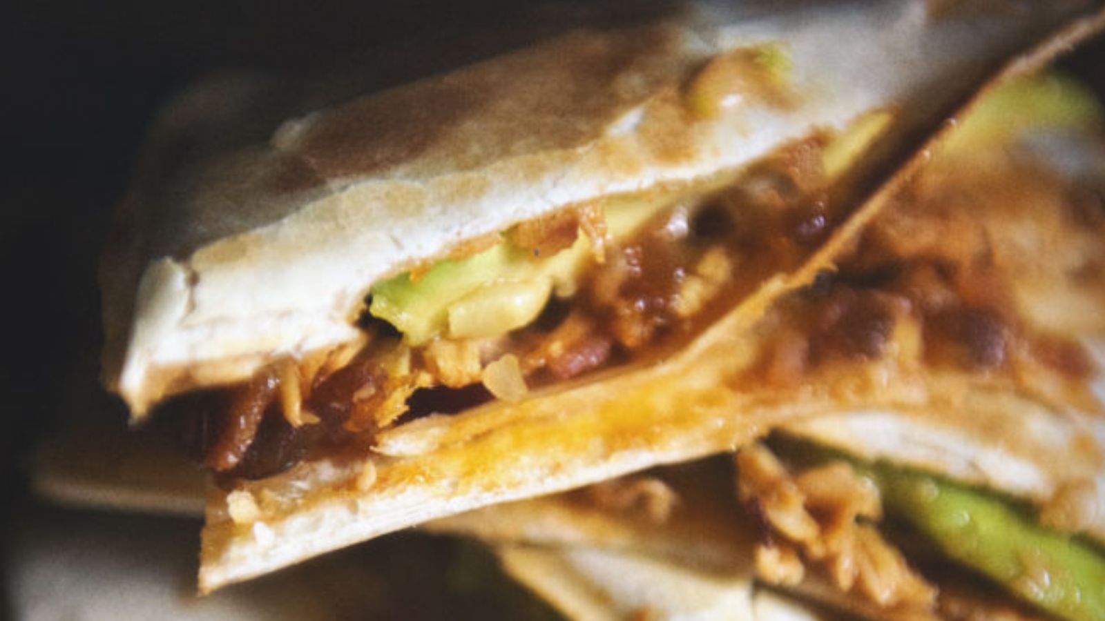 Quesadilla filled with bacon chicken and ranch-style barbecue sauce.