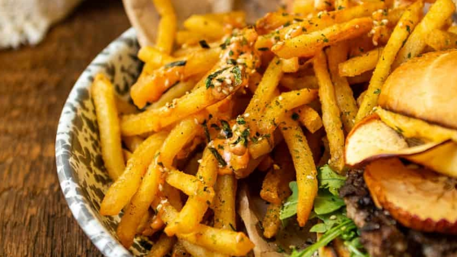 Fries cooked in beef tallow crisped golden and sprinkled with furikake seasoning for crunch.
