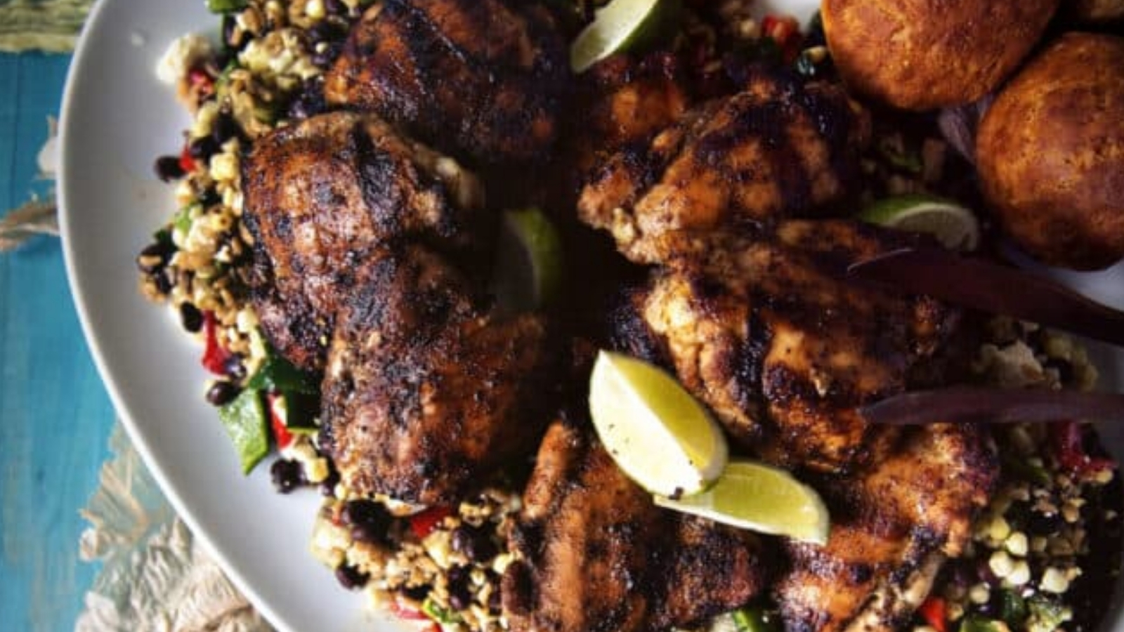 Chicken thighs grilled with ancho spice rub and crisp edges.