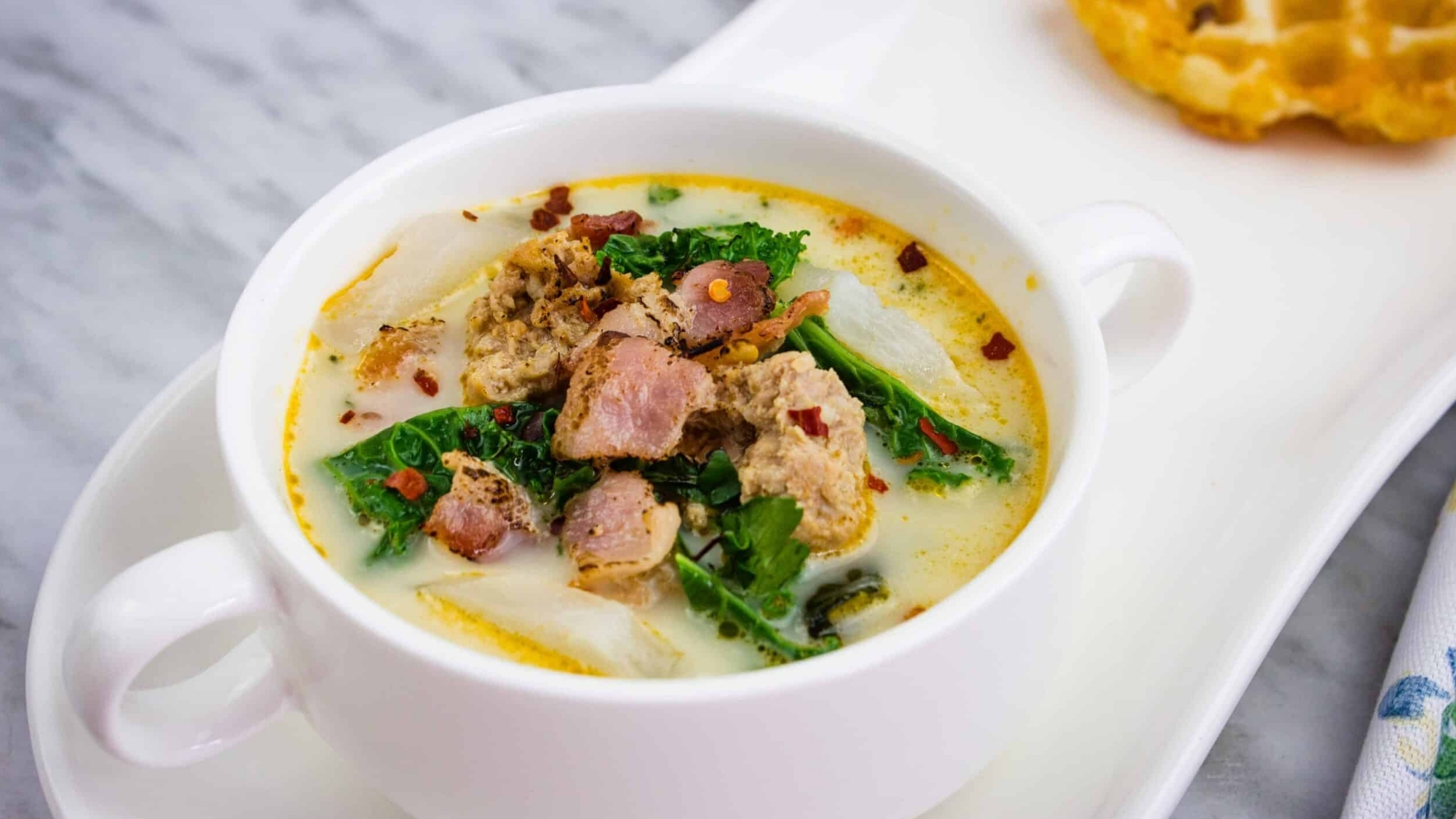 Low Carb Zuppa Toscana Soup in a white round bowl with small handles.