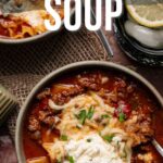 Overhead view of bowls filled with lasagna soup, topped with cheese and herbs, with a spoon and napkin on the side and text overlay about making lasagna soup.