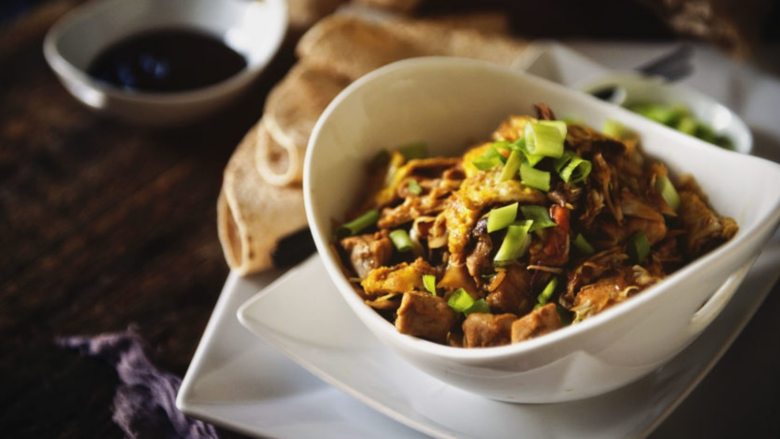Moo shu pork sautéed with cabbage and served with warm wrappers.