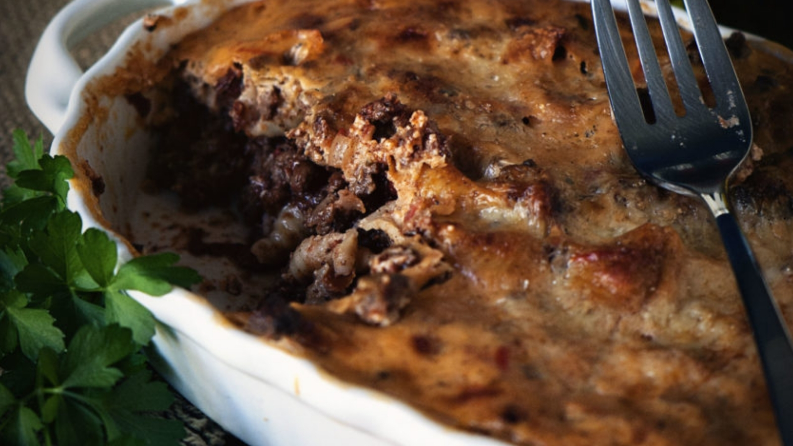 Pastitsio baked with layers of pasta and savory beef.