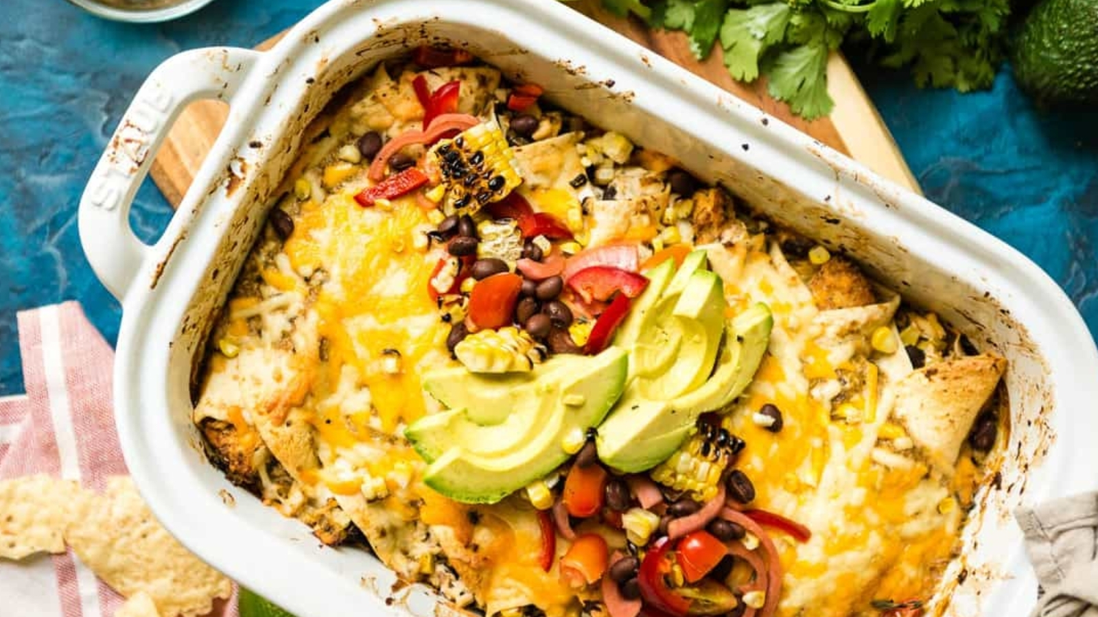 Halibut enchiladas smoked with creamy filling and melted cheese on top.