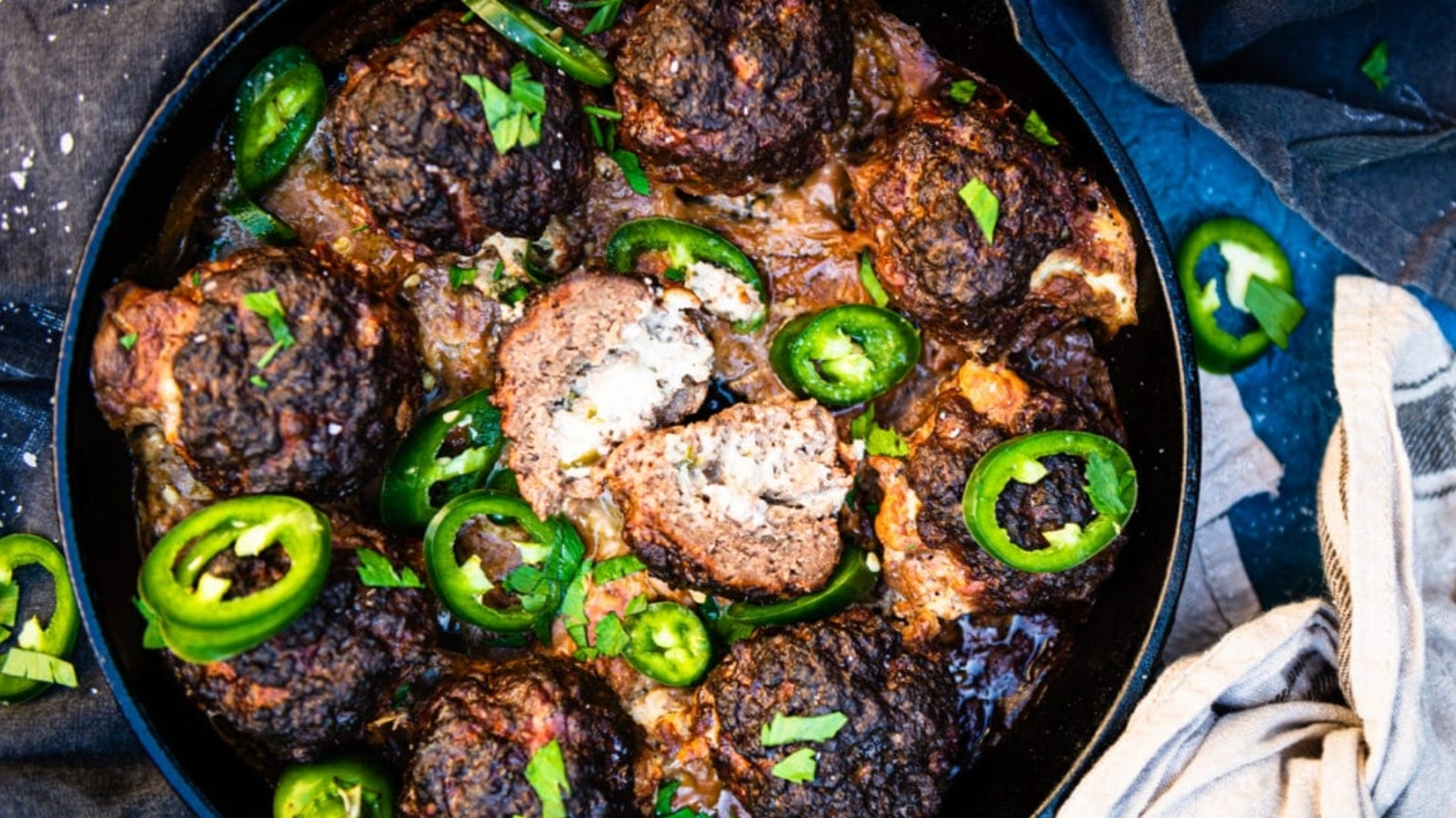 Meatballs filled with jalapeño and cheese smoked until browned and lightly charred.