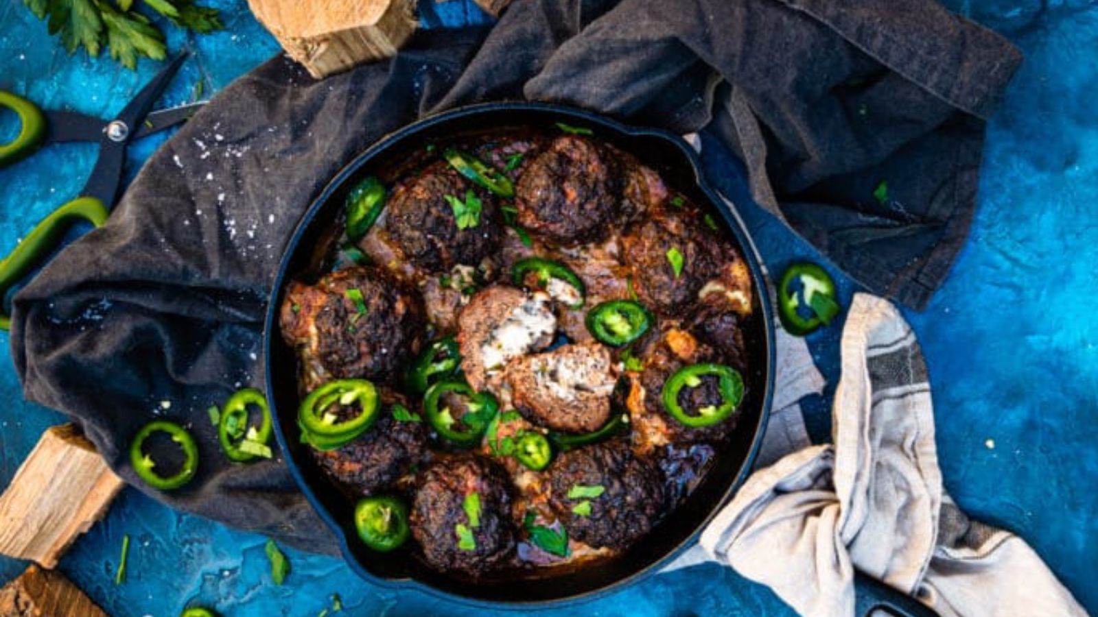Meatballs filled with jalapeño and cheese smoked until browned and lightly charred.