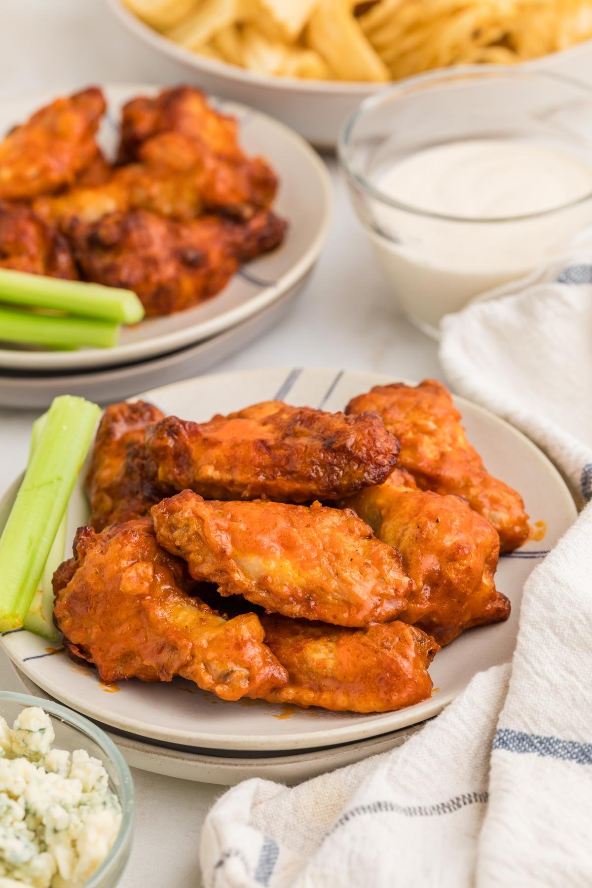 Crispy frozen chicken wings cooked in the air fryer and tossed in buffalo sauce