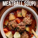 A bowl of albondigas (Mexican meatball soup) with meatballs, potatoes, carrots, and broth, garnished with herbs; text overlay describes the dish and recipe source.
