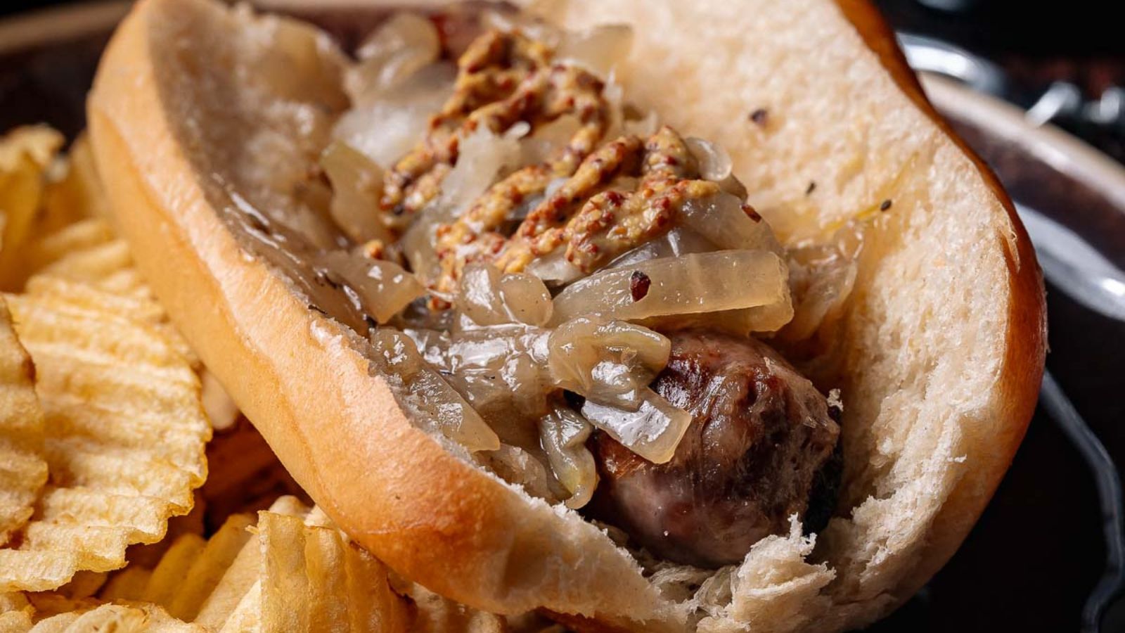 Sausages simmered in beer with onions and finished in a hot skillet.