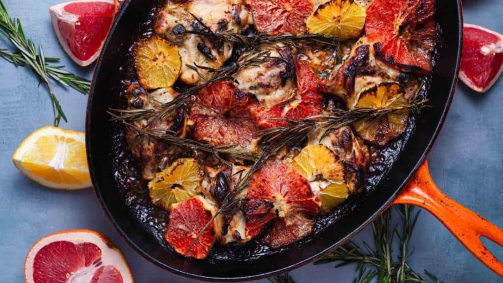 A creamy citrus‑rosemary chicken thigh on a white plate.