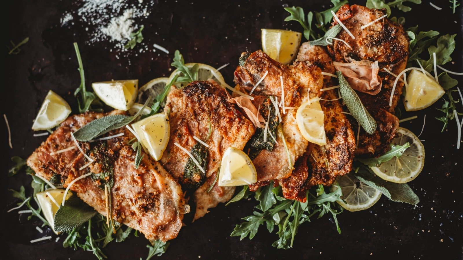 Veal saltimbocca with sage and prosciutto pan cooked golden.