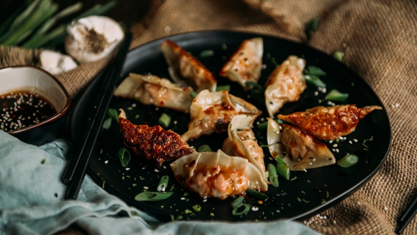 Homemade salmon dumplings folded tight and steamed until glossy, showing soft wrappers filled with tender salmon.