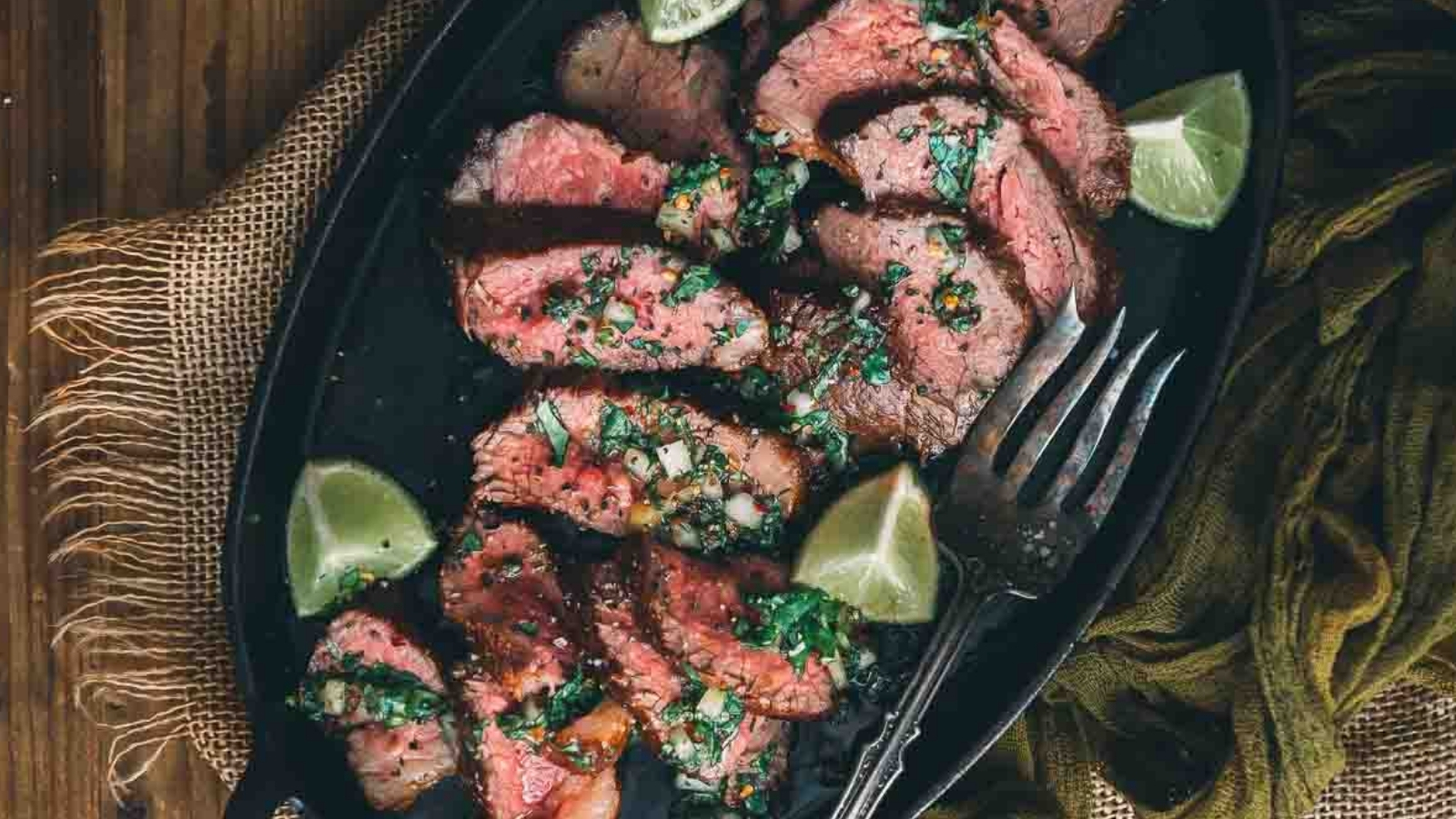 Pan-seared tri-tip steaks sliced thin showing bright pink center and crusty edges.