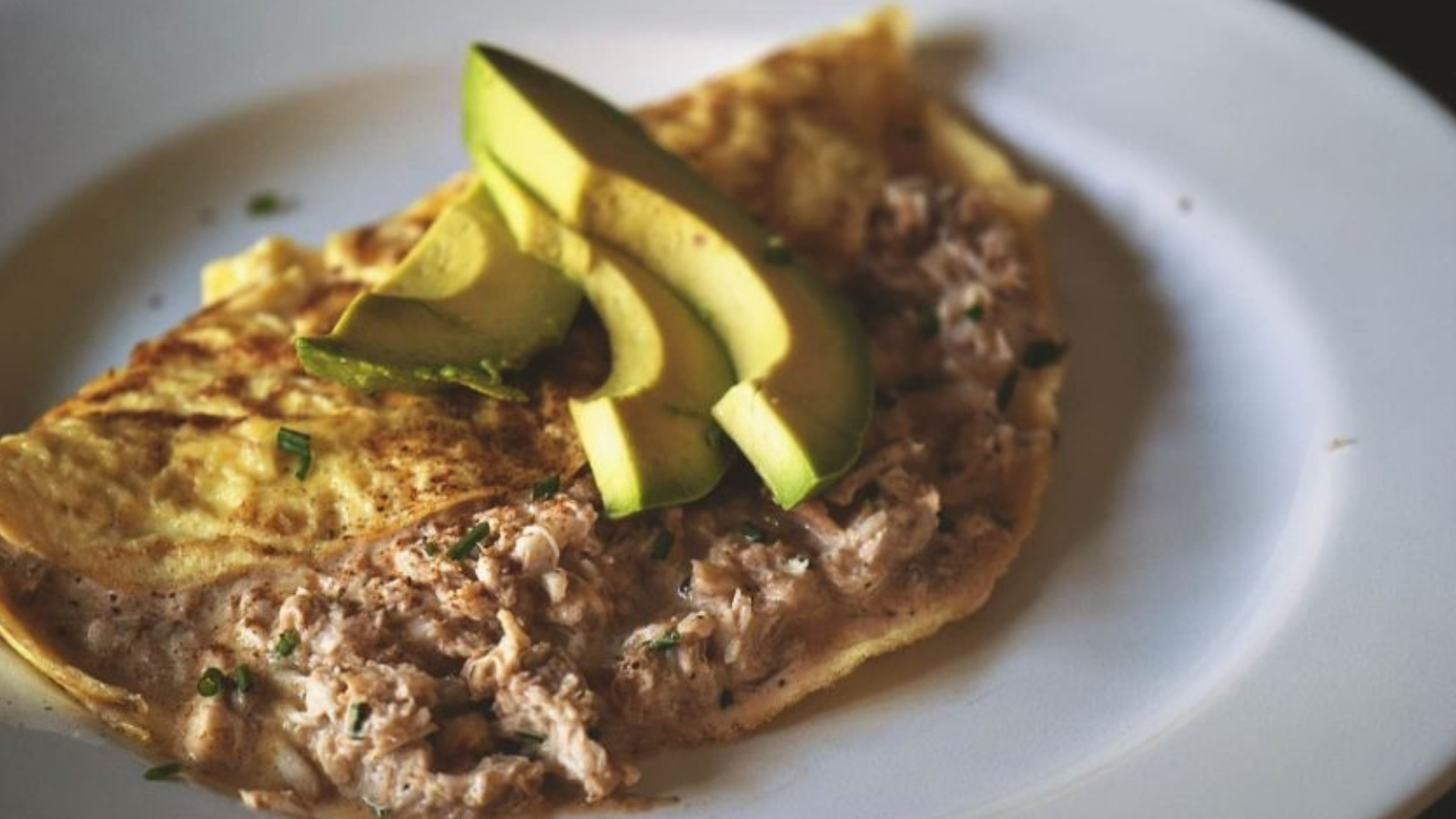 Omelet filled with Chesapeake crab meat folded neatly.