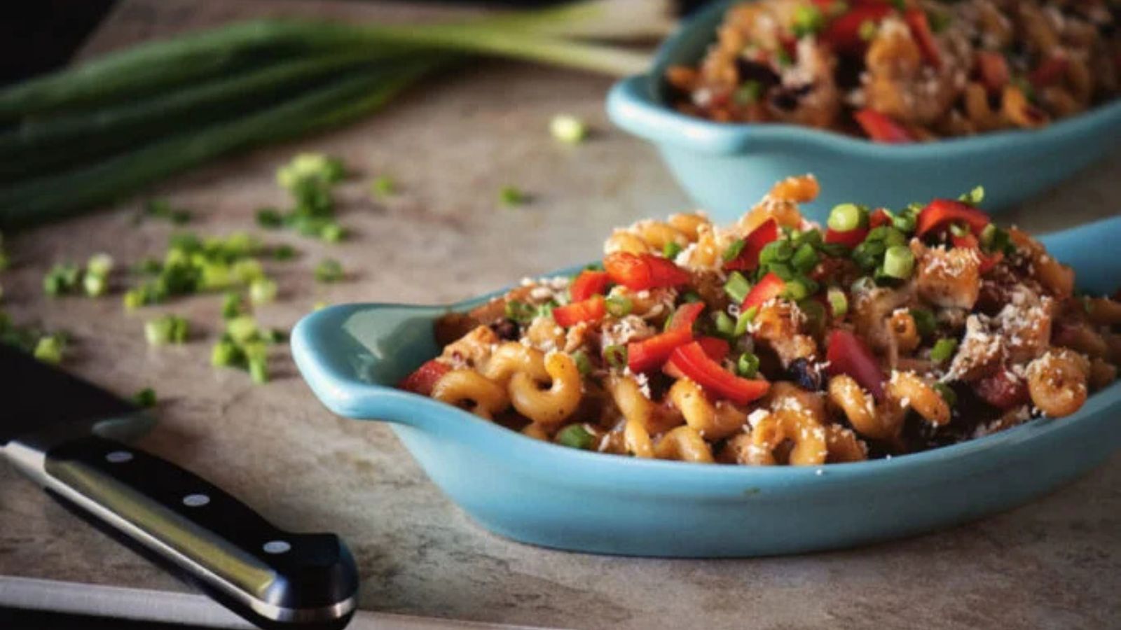 Mac and cheese cooked fiesta style with peppers.