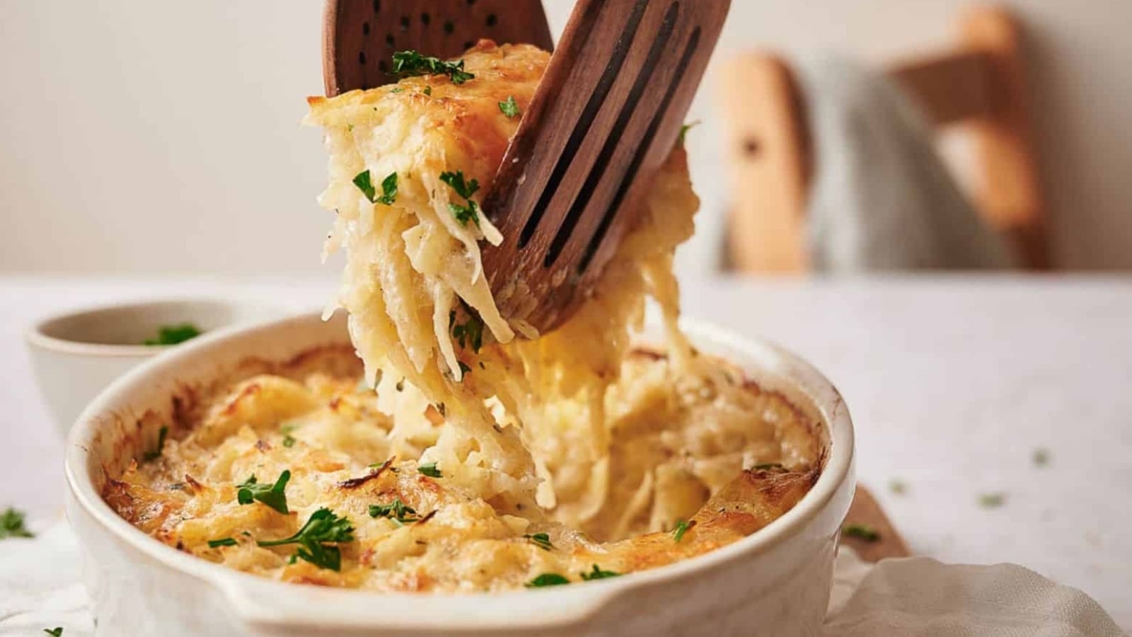 Hashbrown casserole being served.