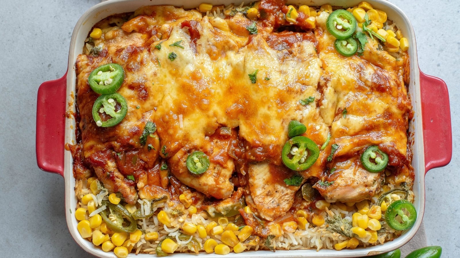 Chicken enchilada casserole with corn and jalapenos.