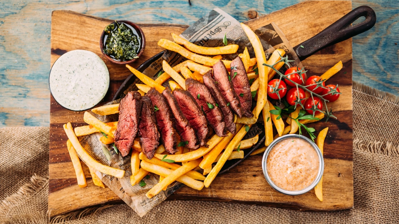 Sous vide flat iron steak sliced to reveal perfect doneness.