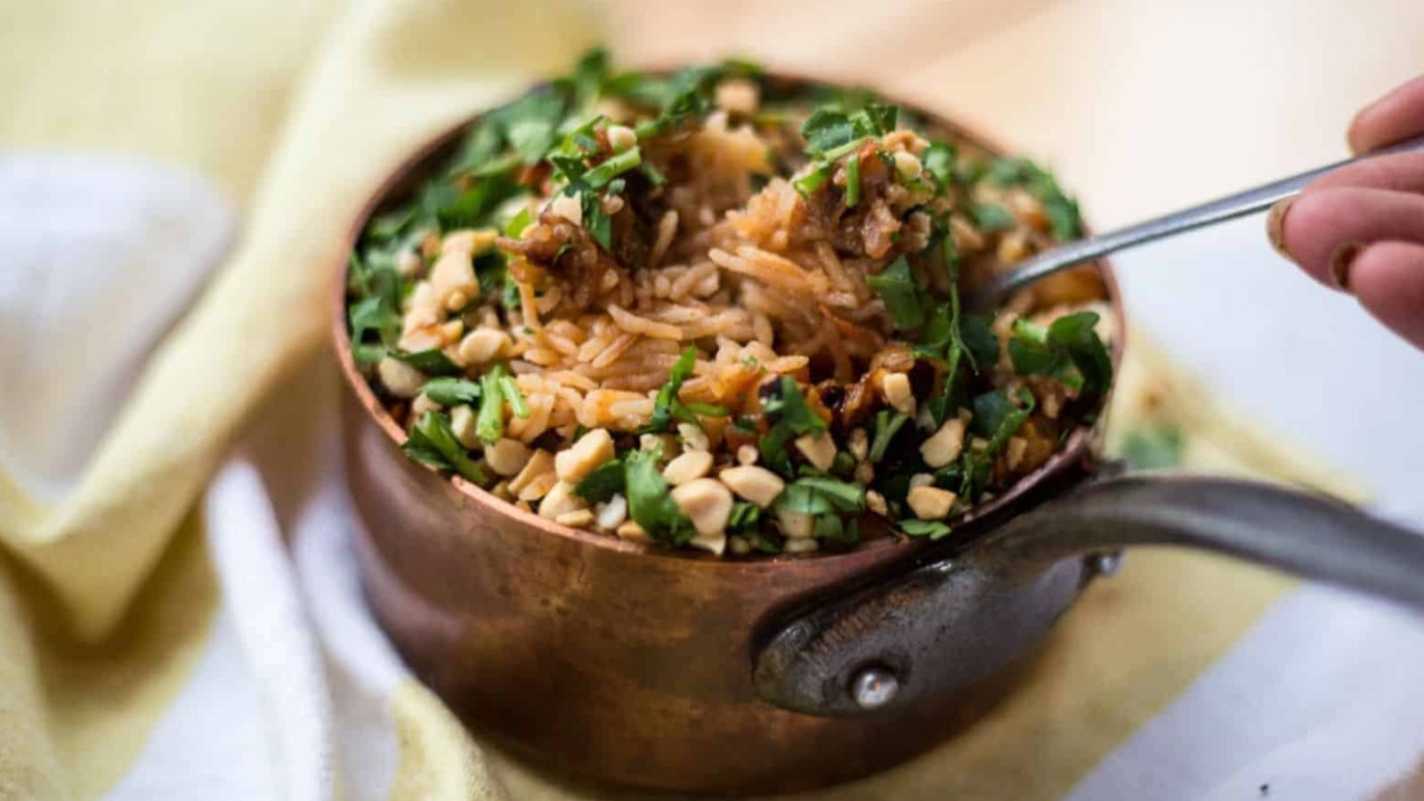 Rice pilaf in copper saucepan.