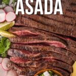 Sliced carne asada steak on a platter, garnished with lime wedges, cilantro, radishes, and diced onions, with text overlay reading "How to Make Carne Asada.