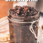 A glass jar filled with dark onion bacon jam sits on a table next to sliced bread; text above reads, "How to make onion bacon jam.