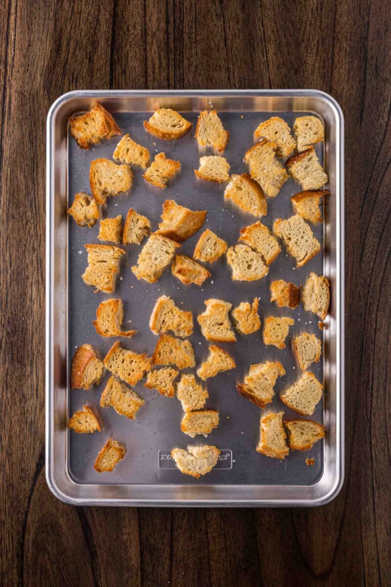 Toasted croutons on a baking sheet.