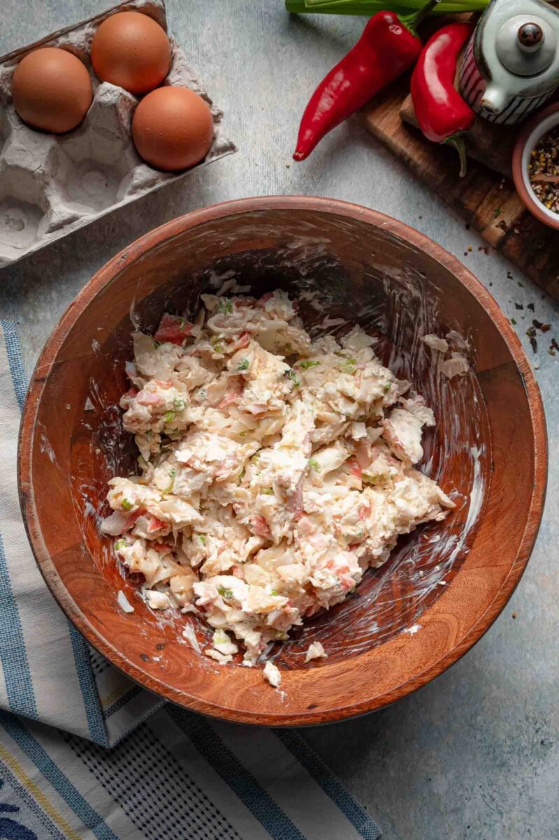 The crab rangoon filling mixed smooth in a wooden bowl, cream cheese worked all the way through the chopped crab.