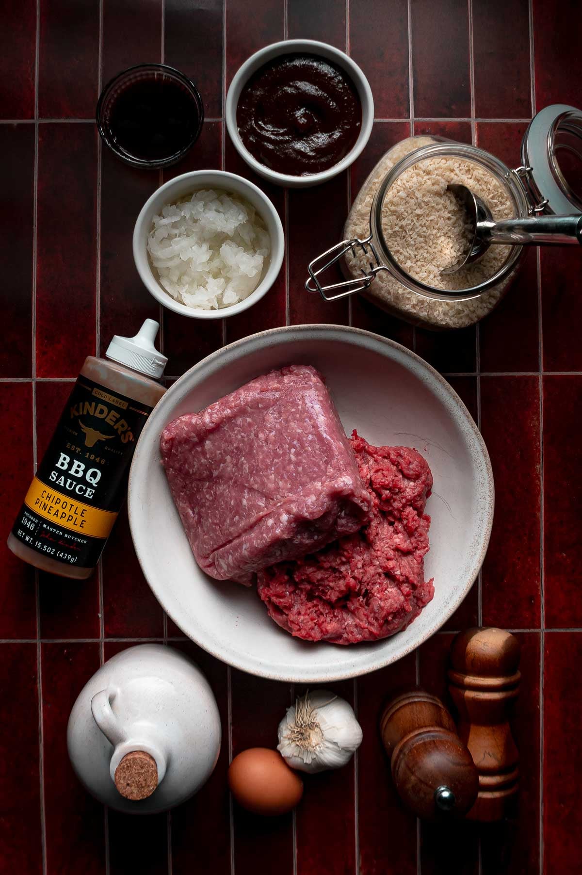 Ingredients for apple butter BBQ meatballs: ground beef and ground pork, Kinder's chipotle pineapple BBQ sauce, apple butter, panko, grated onion, Worcestershire, garlic and an egg.